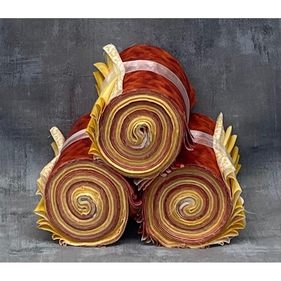 Decorative item resembling a bouquet of red and yellow spiral-patterned rolls on a gray background