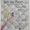 Advertisement for Steady Betty Inc. Betty Bits quilting tools with decorative elements on a textured background.