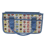 A quilted fabric organizer bag with a colorful floral and bow pattern on a cream background, framed by blue striped borders and solid blue handles, shown against a plain white background.