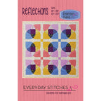 Quilt pattern book cover with colorful quilt design on a pink background