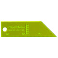 A lime green Moda Fabrics Supplies triangular ruler with measurement markings in inches and centimeters, featuring a circular hole on the left side.