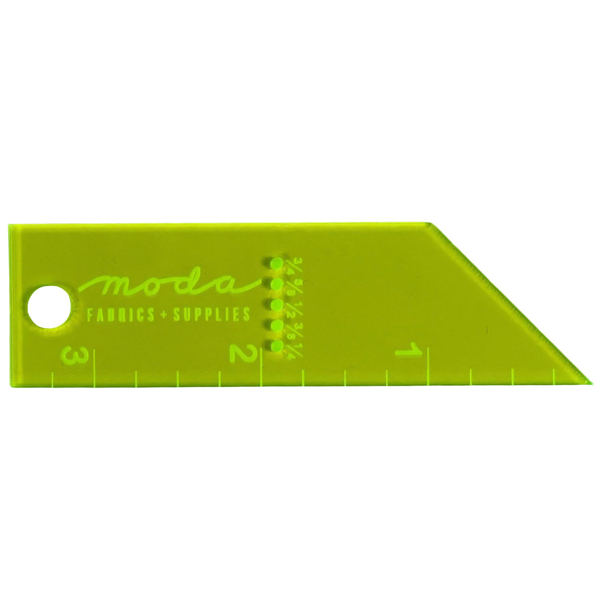 A lime green Moda Fabrics Supplies triangular ruler with measurement markings in inches and centimeters, featuring a circular hole on the left side.