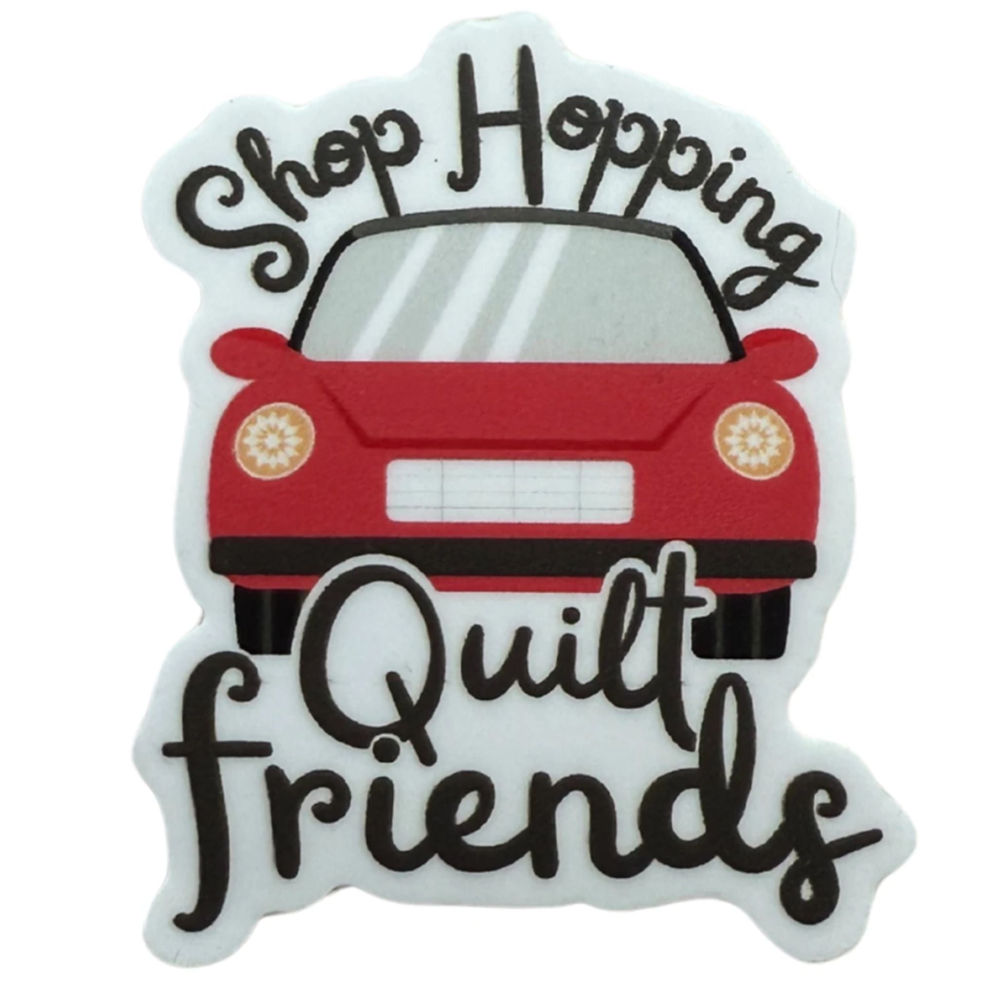 A die-cut white sticker or patch featuring a red car illustration with the words 'Shop Hopping' above and 'Quilt friends' below in black script.